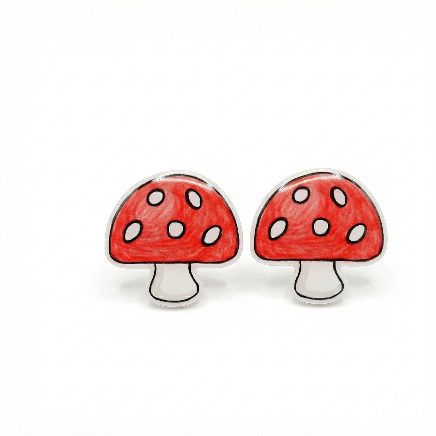 Red mushroom-shaped earrings on a white background