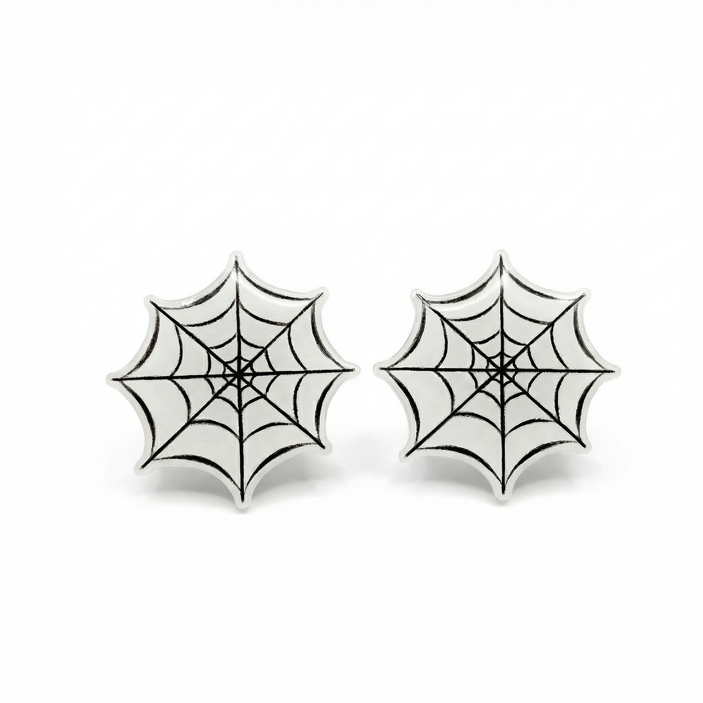 Pair of spider web earrings on a white background