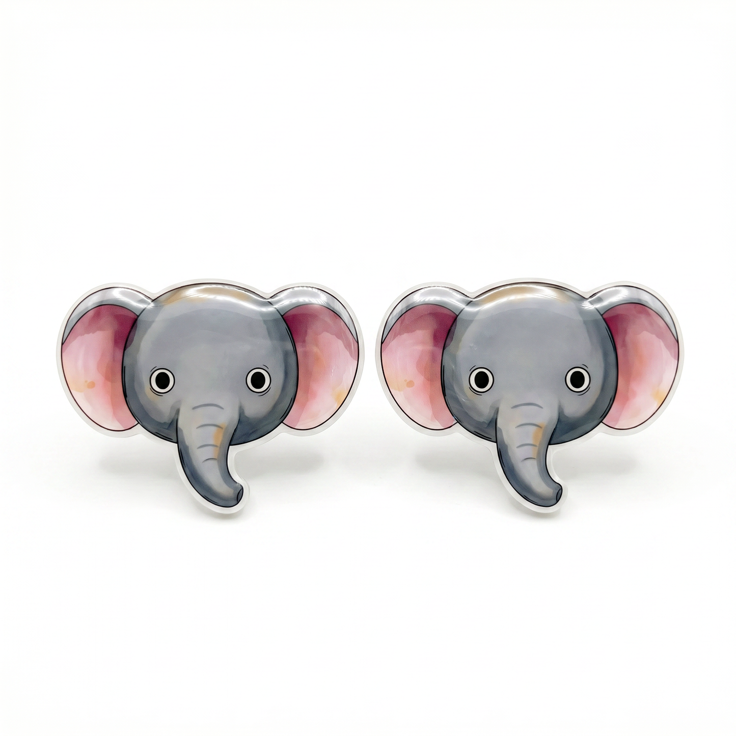 A pair of stud earrings shaped like cartoon elephant heads, featuring gray faces and trunks with pink inner ears and silver-tone edges, shown on a plain white background.