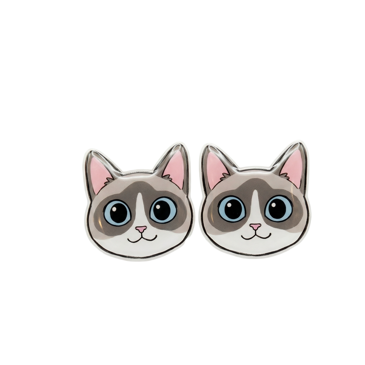 A pair of Snowshoe / Ragdoll cat-face stud earrings with gray and white fur, blue eyes, pink inner ears, and a silver-tone metal border, shown on a plain white background.