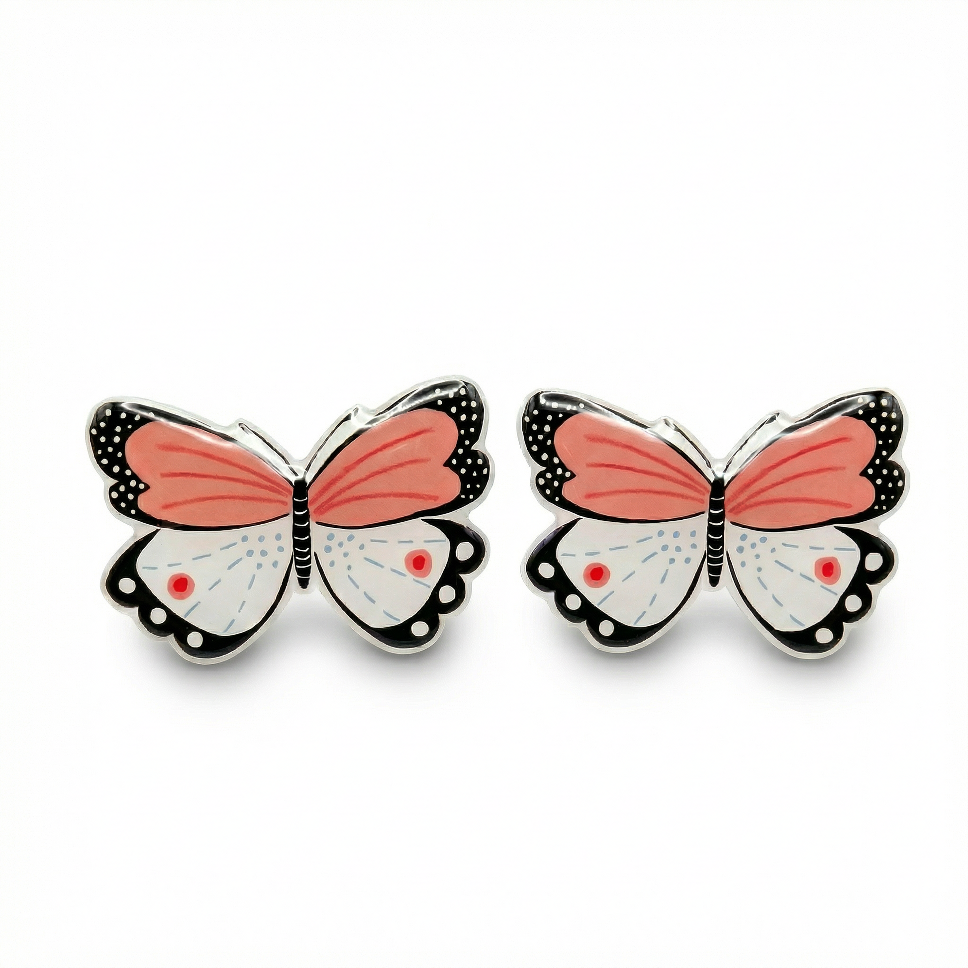 Butterfly-shaped earrings with pink wings on a white background