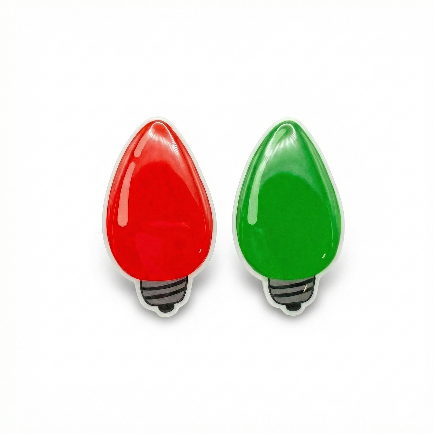 Red and green Christmas light bulb earrings on a white background