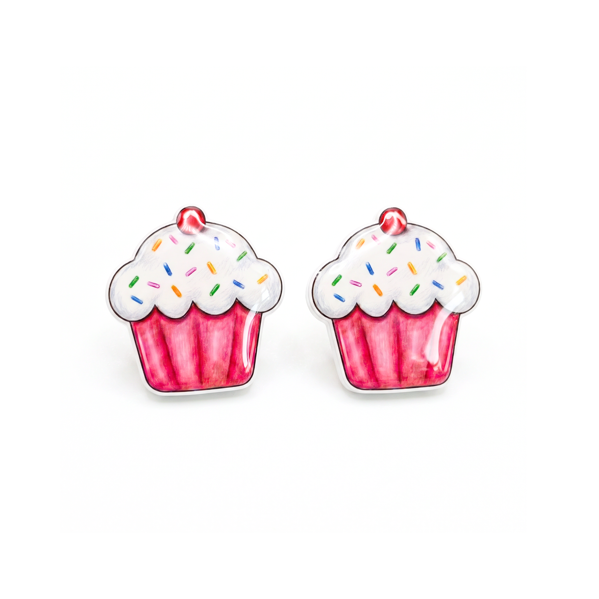 A pair of cupcake-shaped stud earrings with pink wrappers, white frosting, and colorful sprinkles on a plain white background.