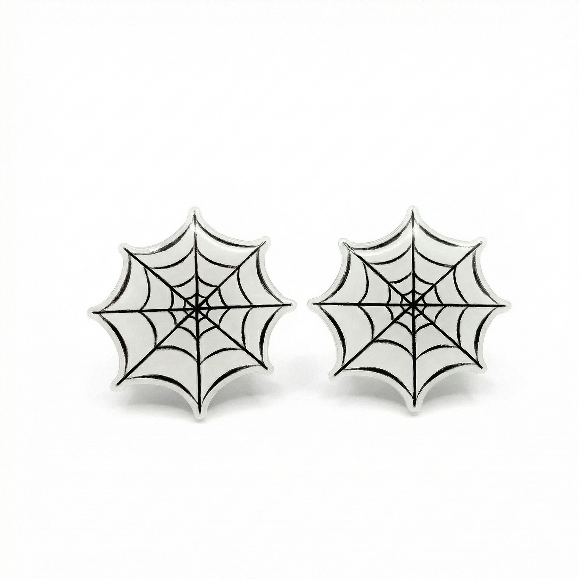 Pair of spider web earrings on a white background