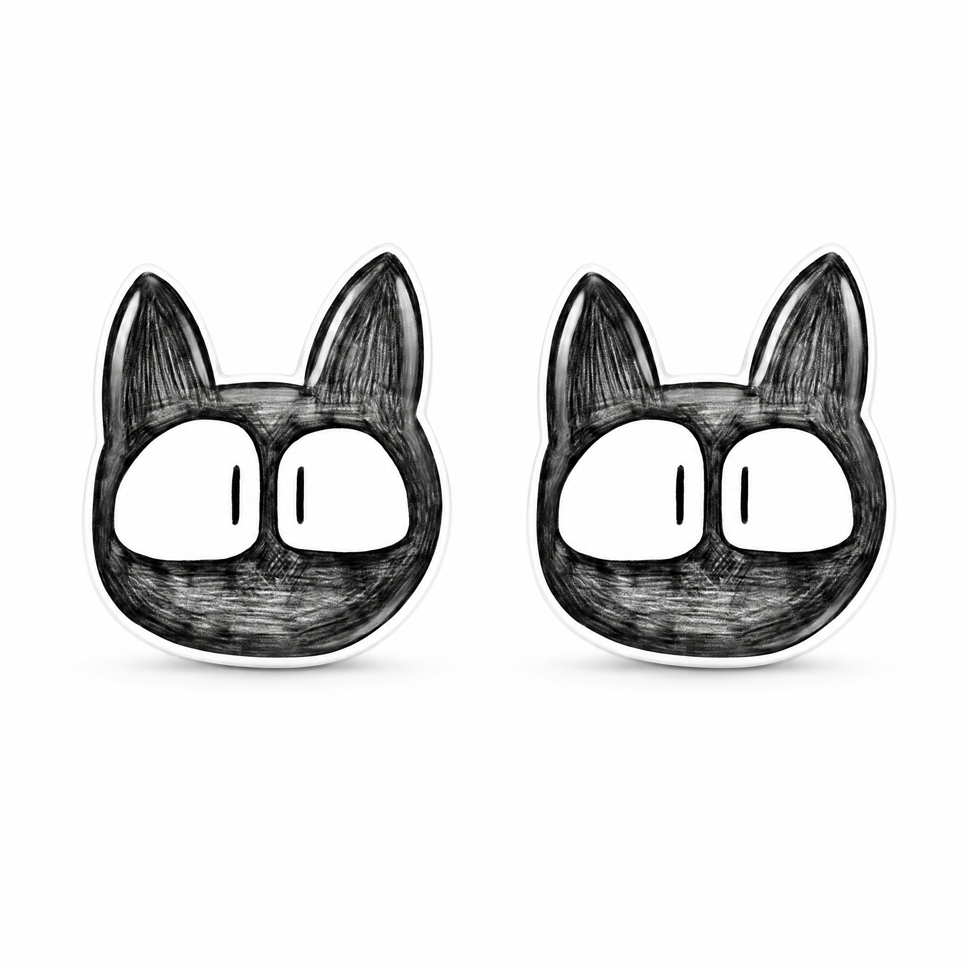 A pair of black and white cartoon cat face titanium stud earrings on a plain white background.