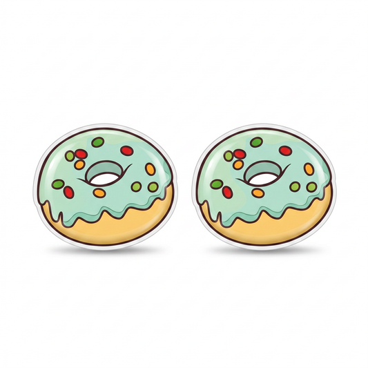 A pair of donut-shaped titanium stud earrings with mint green frosting, colorful sprinkles, and a golden-yellow filling, shown on a plain white background.